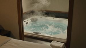 Couple relaxing in a hot tub during a romantic break.