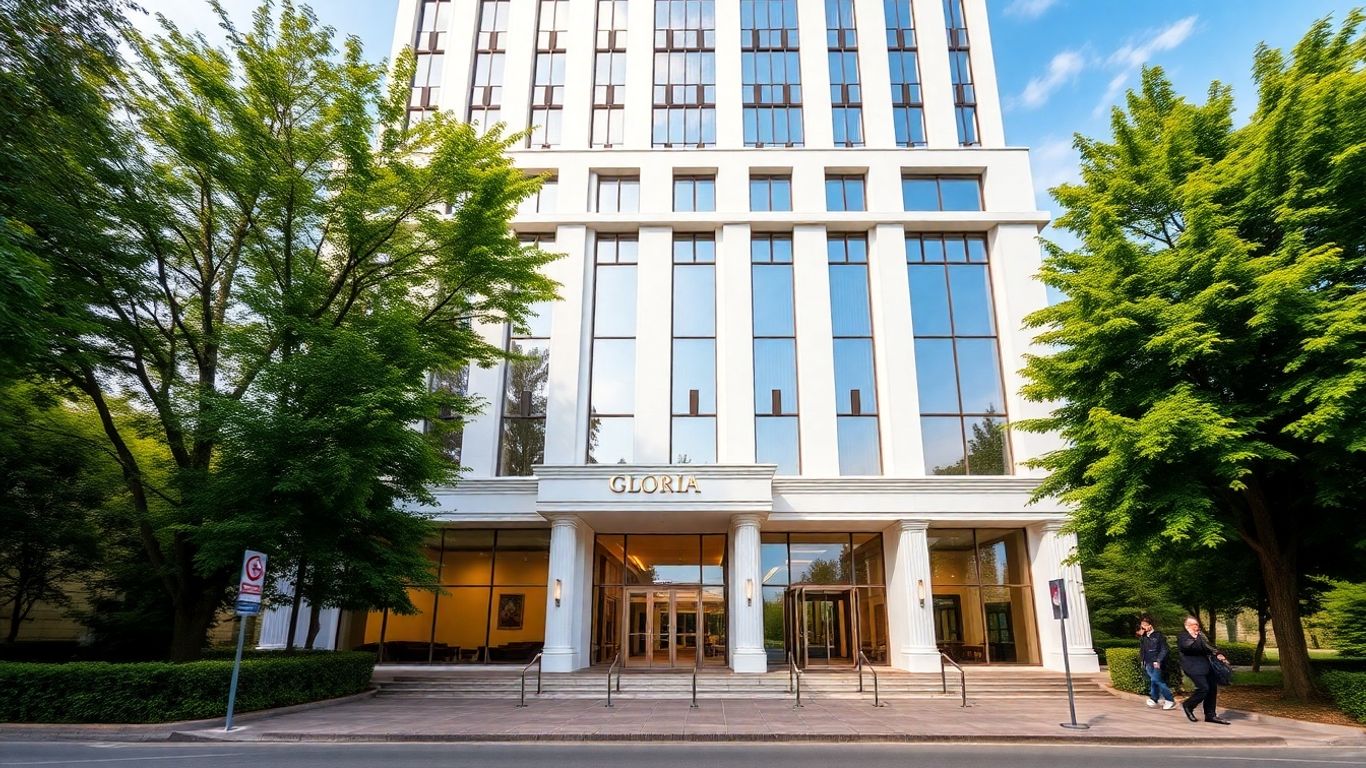 Gloria Hotel Tashkent exterior with lush greenery.
