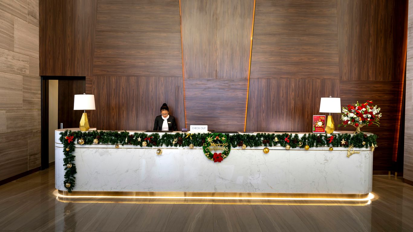 a woman sitting at a desk with a laptop