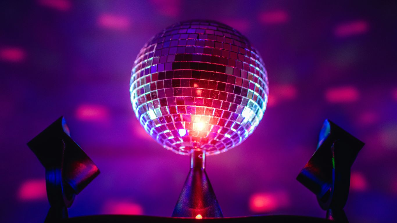 a disco ball sitting on top of a metal pole