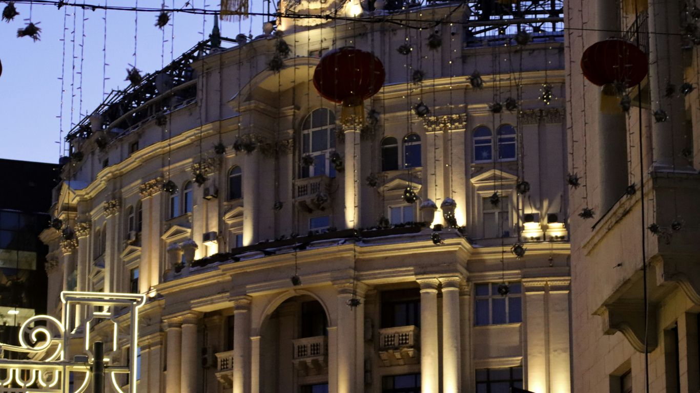 a large building with a clock on the top of it